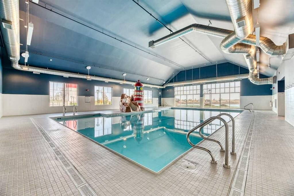 589 Clearwater Heath, Chestermere, AB - Indoor Photo Showing Other Room With In Ground Pool
