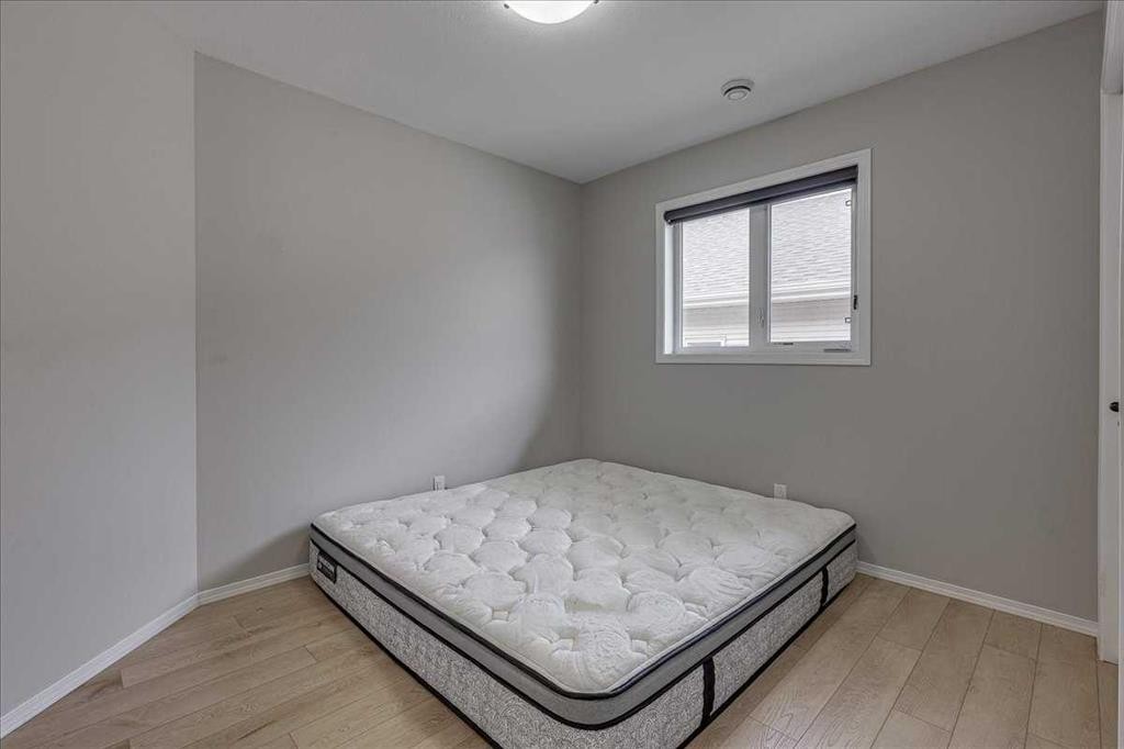 13 Rogers Road, Sylvan Lake, AB - Indoor Photo Showing Bedroom