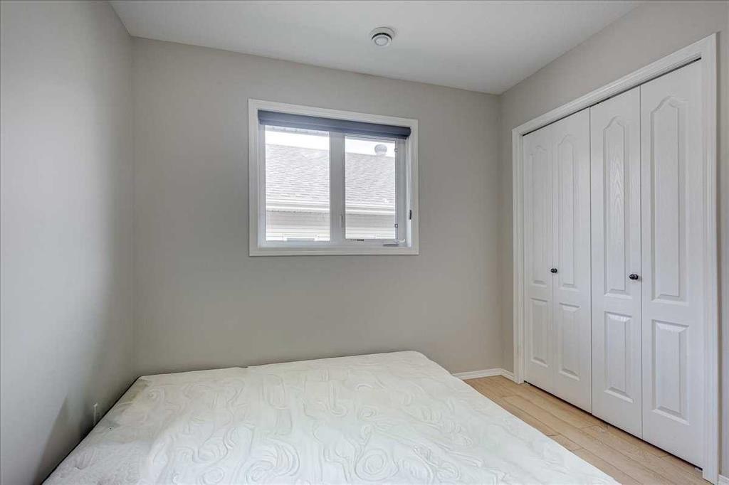13 Rogers Road, Sylvan Lake, AB - Indoor Photo Showing Bedroom