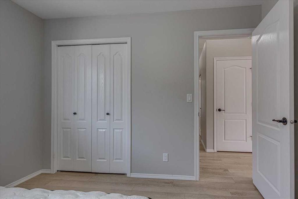 13 Rogers Road, Sylvan Lake, AB - Indoor Photo Showing Bedroom