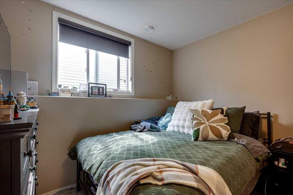 13 Rogers Road, Sylvan Lake, AB - Indoor Photo Showing Bedroom