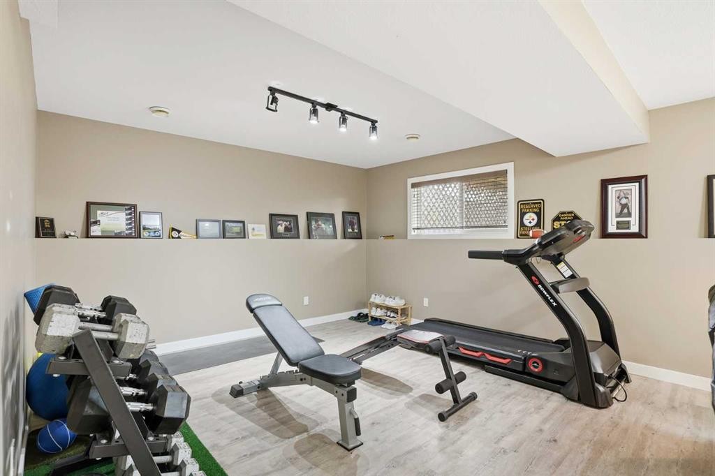 144 Bowman Circle, Sylvan Lake, AB - Indoor Photo Showing Gym Room