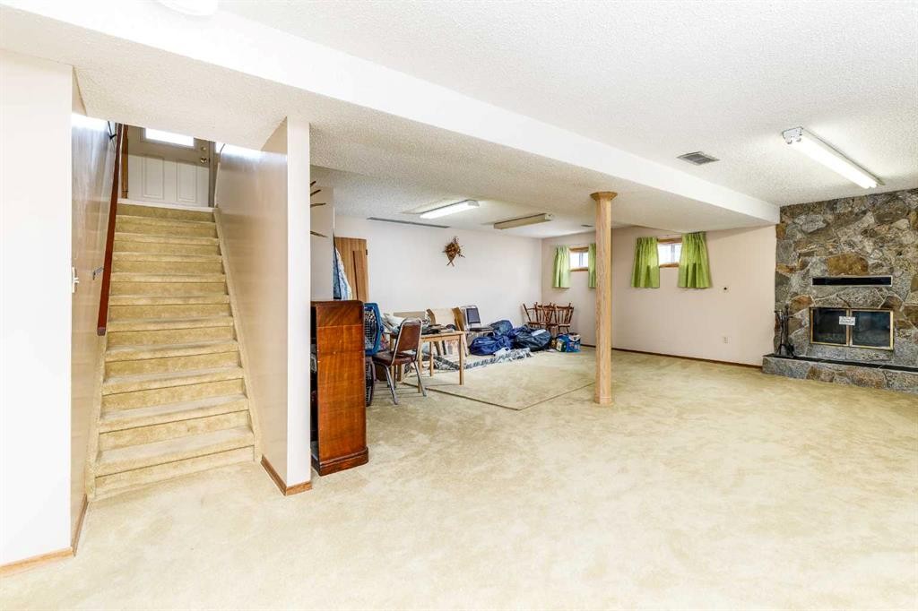 88 Mccullough Cresent, Red Deer, AB - Indoor With Fireplace
