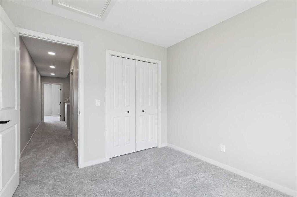 78 Bluerock Hill Sw, Calgary, AB - Indoor Photo Showing Other Room