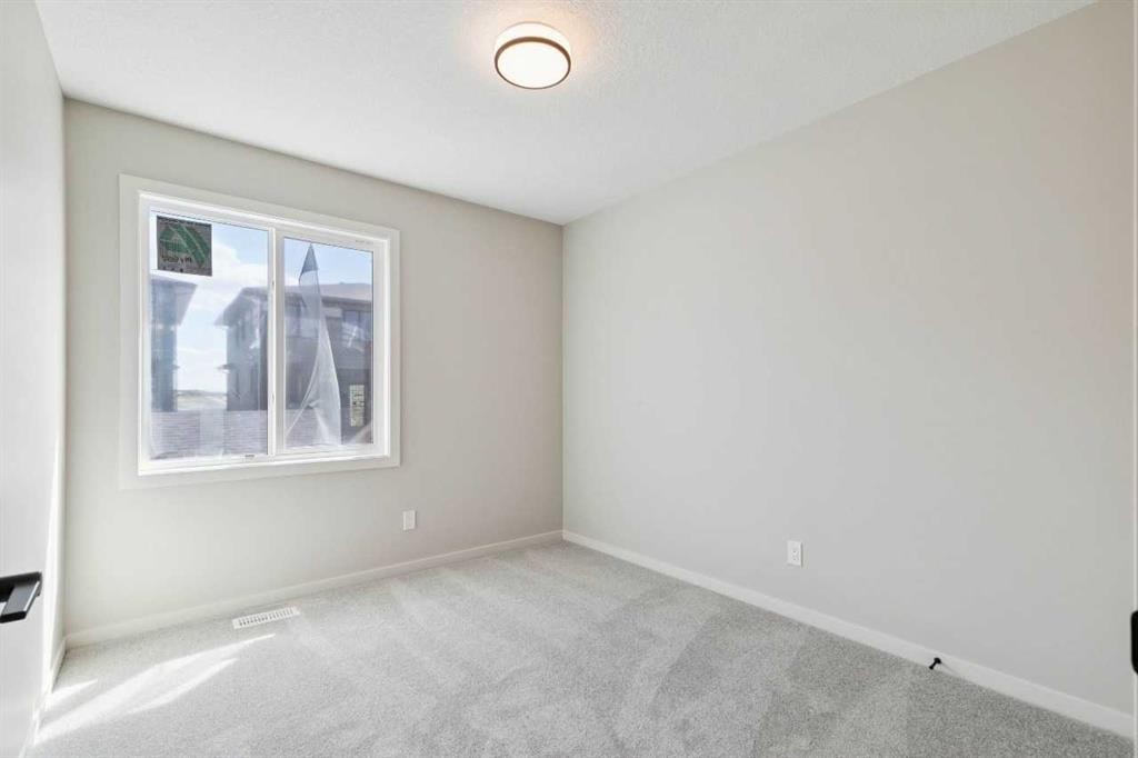 78 Bluerock Hill Sw, Calgary, AB - Indoor Photo Showing Other Room