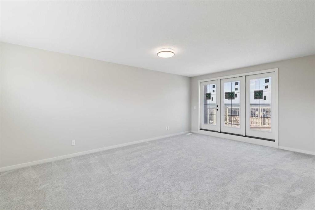 78 Bluerock Hill Sw, Calgary, AB - Indoor Photo Showing Other Room