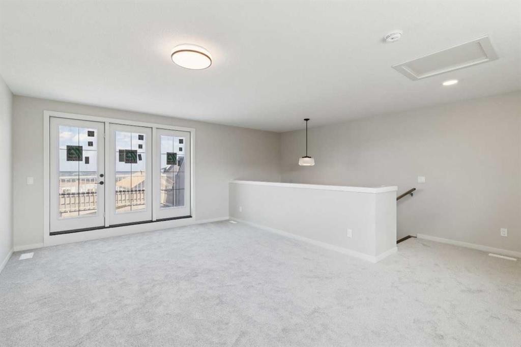 78 Bluerock Hill Sw, Calgary, AB - Indoor Photo Showing Other Room