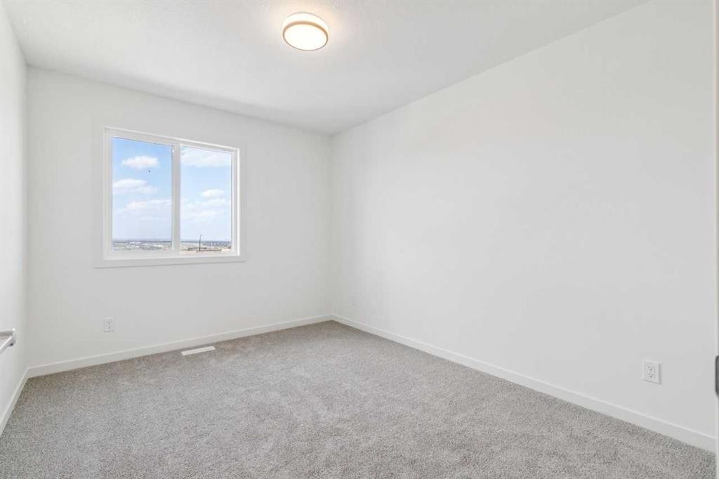 37 Bluerock Hill Sw, Calgary, AB - Indoor Photo Showing Other Room