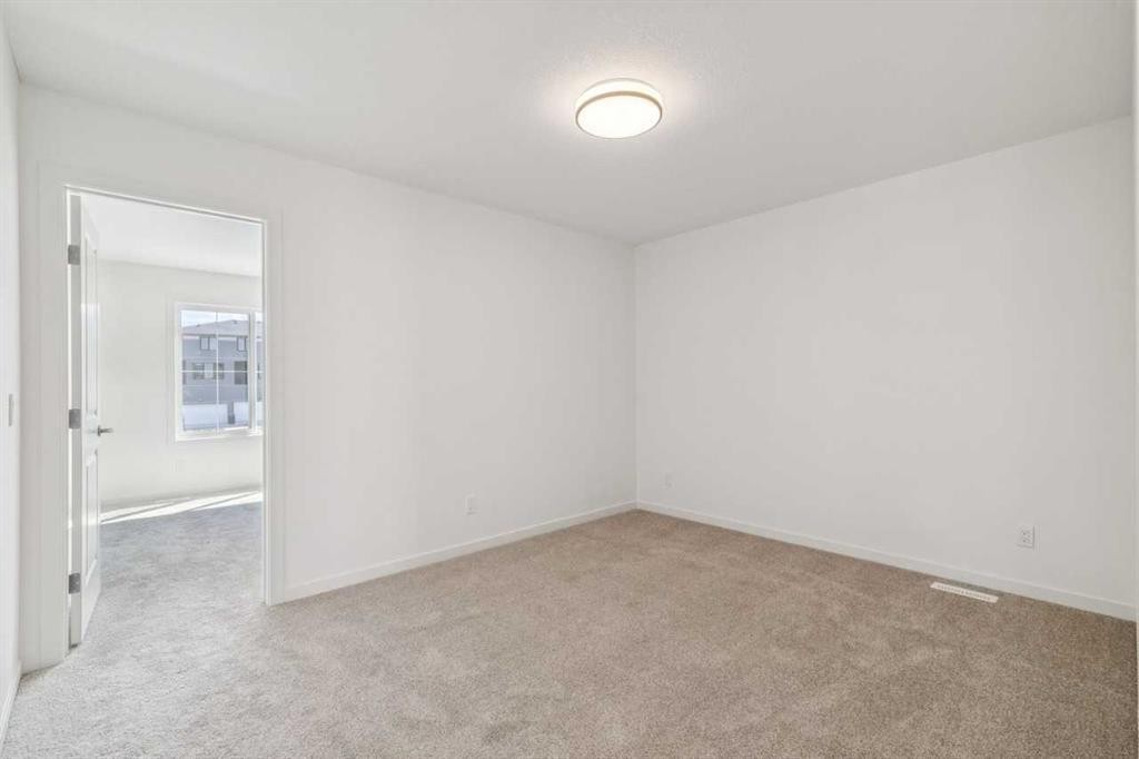 37 Bluerock Hill Sw, Calgary, AB - Indoor Photo Showing Other Room