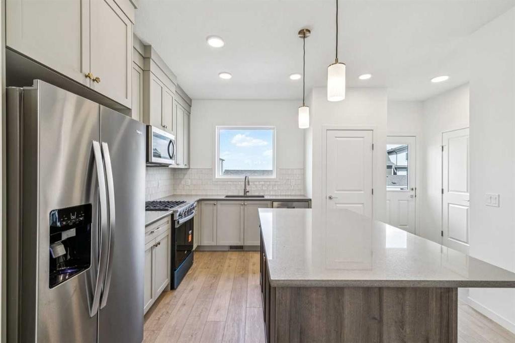 37 Bluerock Hill Sw, Calgary, AB - Indoor Photo Showing Kitchen With Upgraded Kitchen
