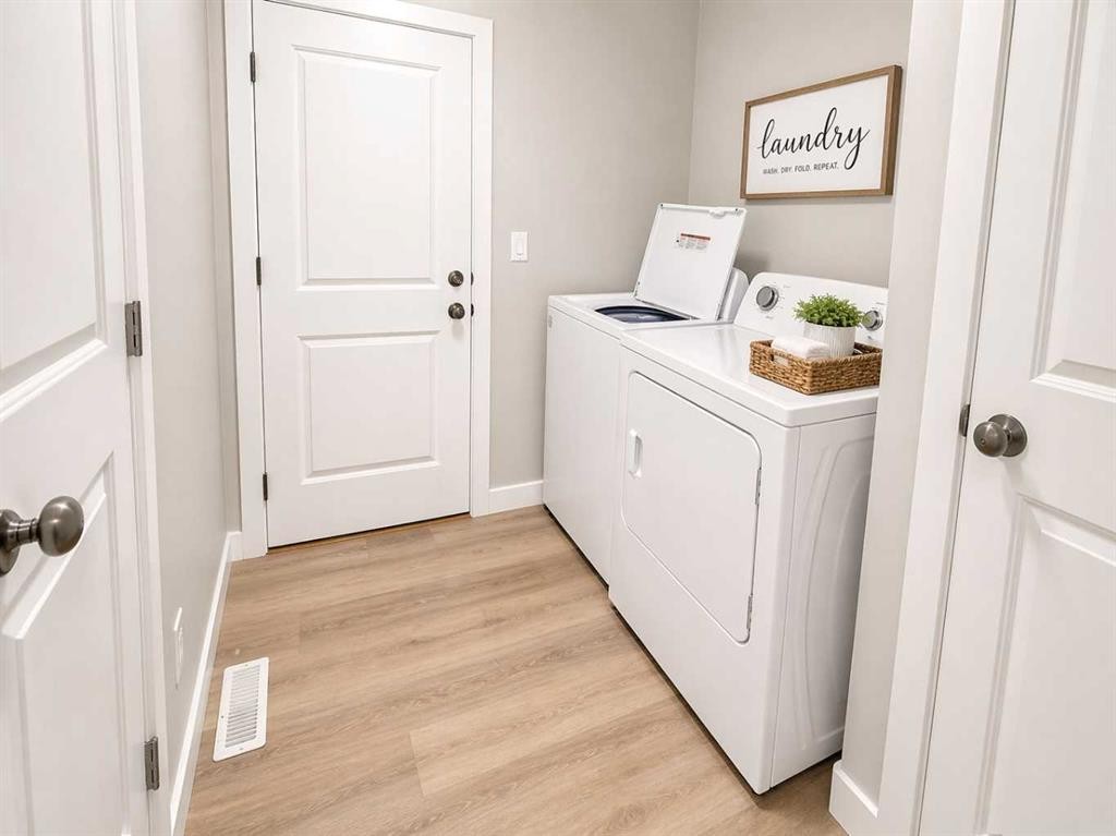 4438 Van Eaton Way, Clive, AB - Indoor Photo Showing Laundry Room