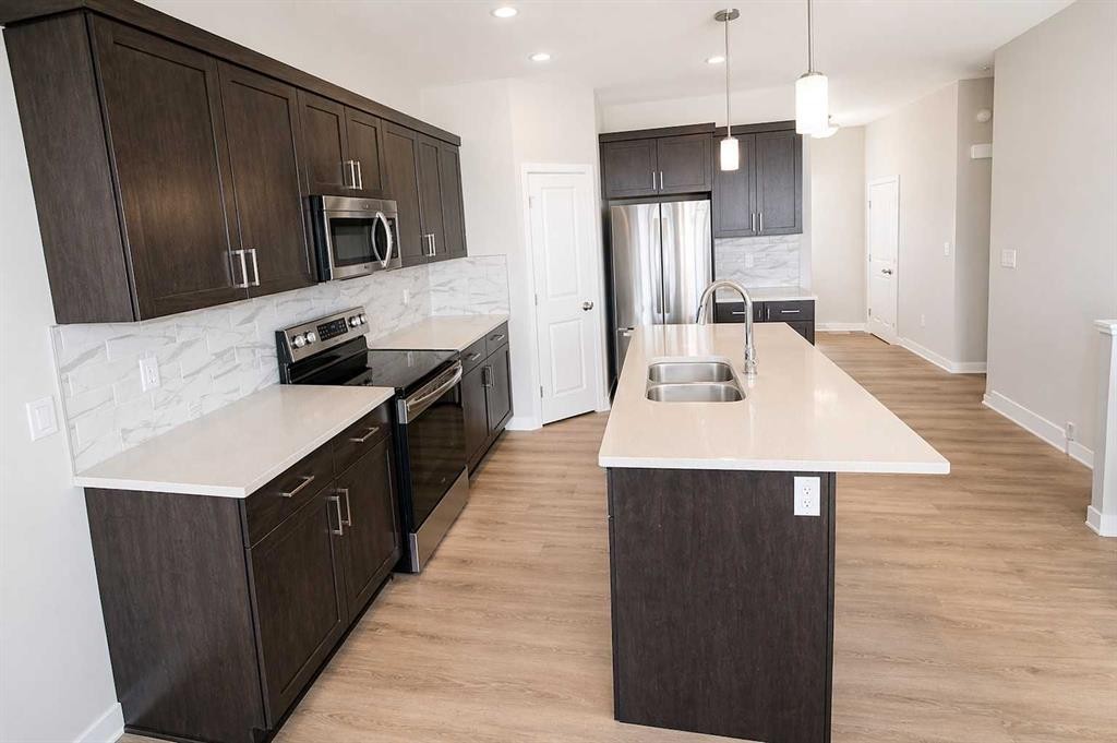 4438 Van Eaton Way, Clive, AB - Indoor Photo Showing Kitchen With Stainless Steel Kitchen With Double Sink With Upgraded Kitchen