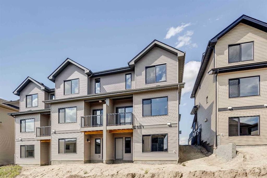 386 Heritage Boulevard, Cochrane, AB - Outdoor With Facade