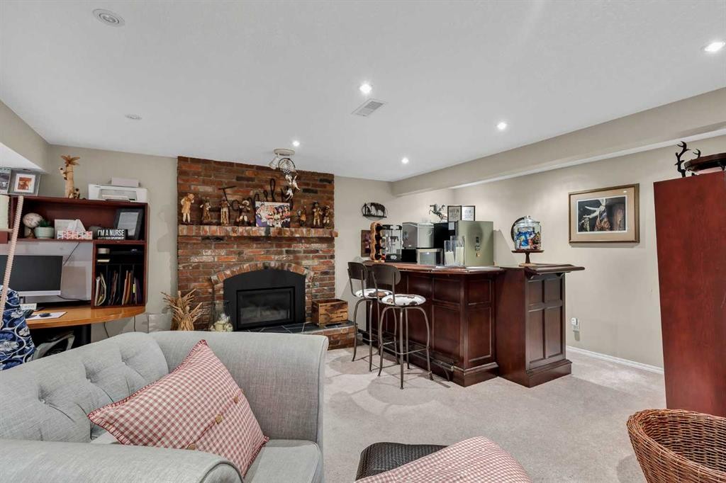 9111 Fairmount Drive Se, Calgary, AB - Indoor Photo Showing Other Room With Fireplace