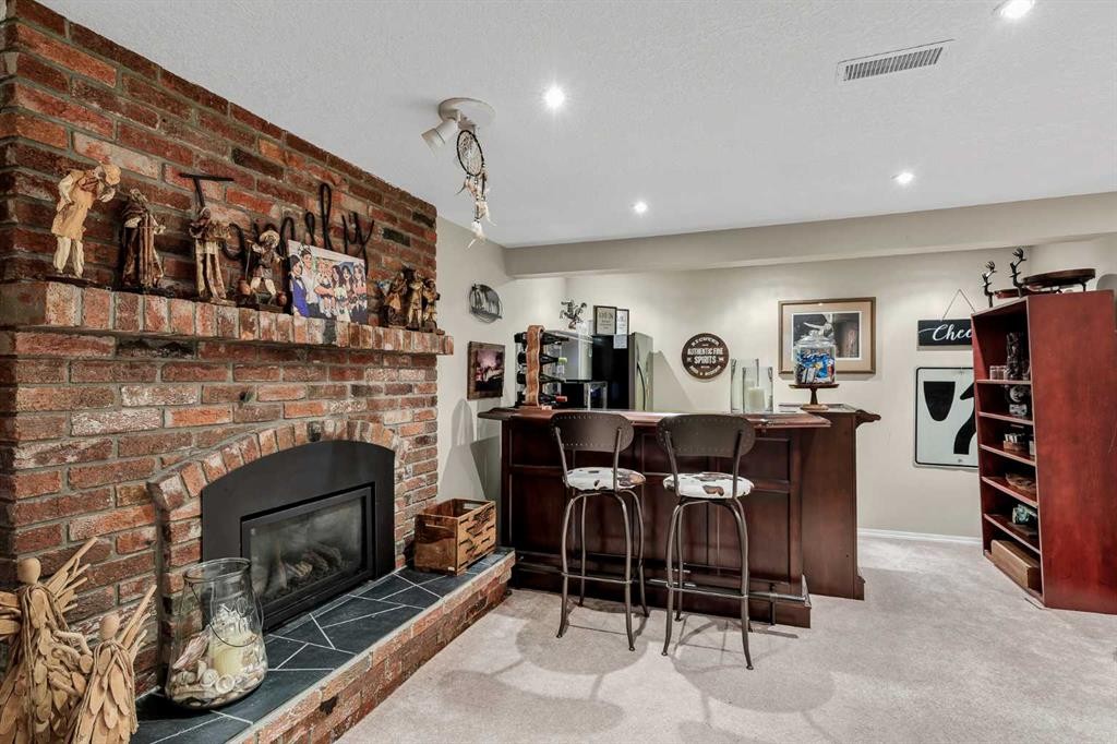9111 Fairmount Drive Se, Calgary, AB - Indoor With Fireplace