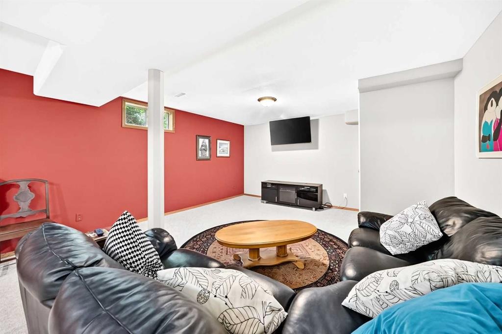 94 Hathaway Lane, Lacombe, AB - Indoor Photo Showing Living Room With Fireplace