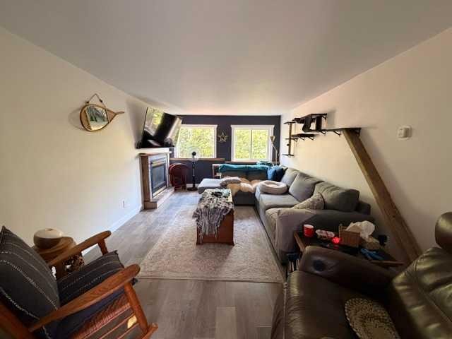 5412 49 A Avenue, Alix, AB - Indoor Photo Showing Living Room With Fireplace