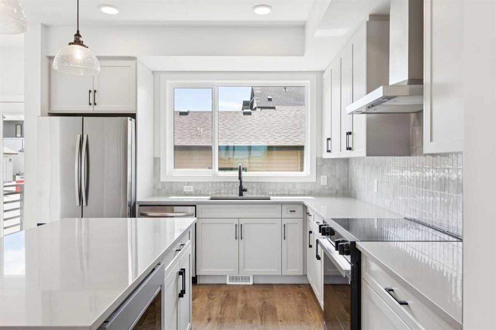49 Silverton Glen Way Sw, Calgary, AB - Indoor Photo Showing Kitchen With Upgraded Kitchen
