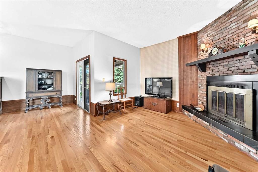 3 43 Avenue Close, Lacombe, AB - Indoor Photo Showing Living Room With Fireplace