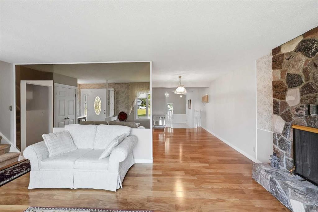8 Sydney Close, Red Deer, AB - Indoor Photo Showing Living Room With Fireplace