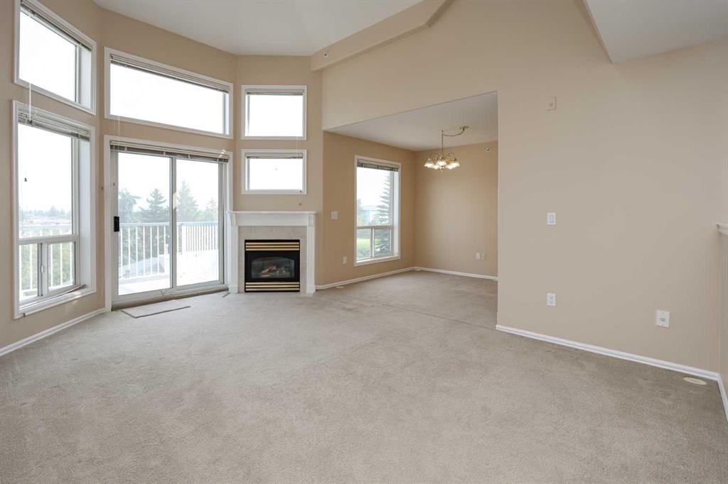 409-6118 53 Avenue, Red Deer, AB - Indoor With Fireplace