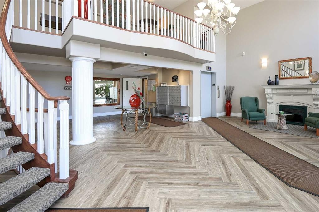 409-6118 53 Avenue, Red Deer, AB - Indoor With Fireplace