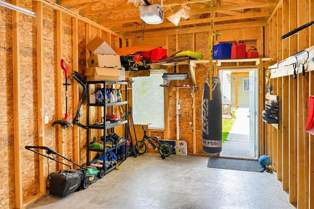 63 Hawkridge Boulevard, Penhold, AB - Indoor Photo Showing Garage
