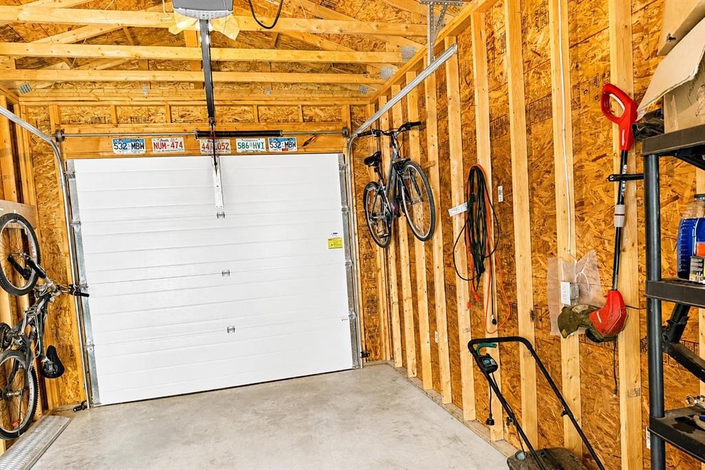 63 Hawkridge Boulevard, Penhold, AB - Indoor Photo Showing Garage