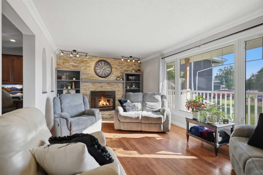 31 Willow Crescent, Lacombe, AB - Indoor Photo Showing Living Room With Fireplace