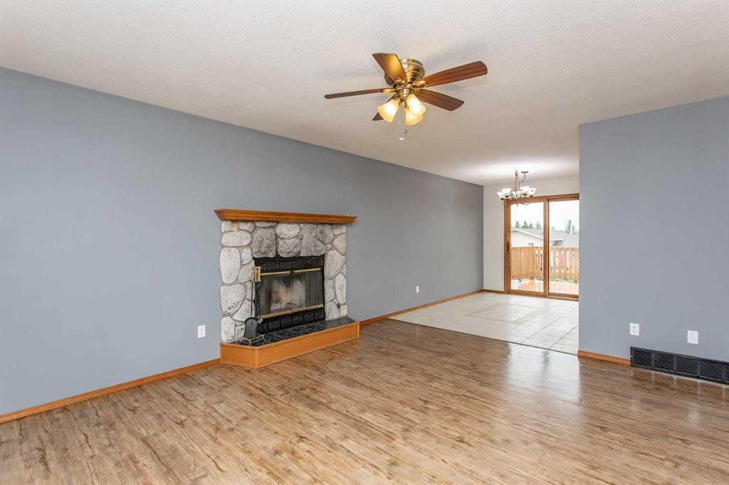 22 Bruns Crescent, Lacombe, AB - Indoor Photo Showing Living Room With Fireplace