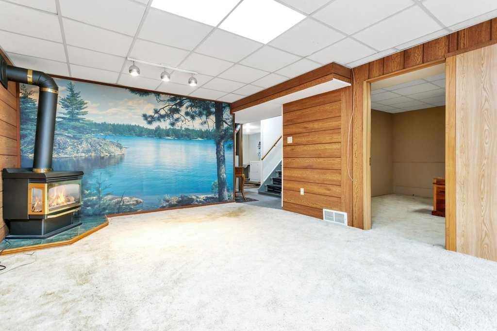 6739 59Th Avenue, Red Deer, AB - Indoor Photo Showing Other Room With Fireplace