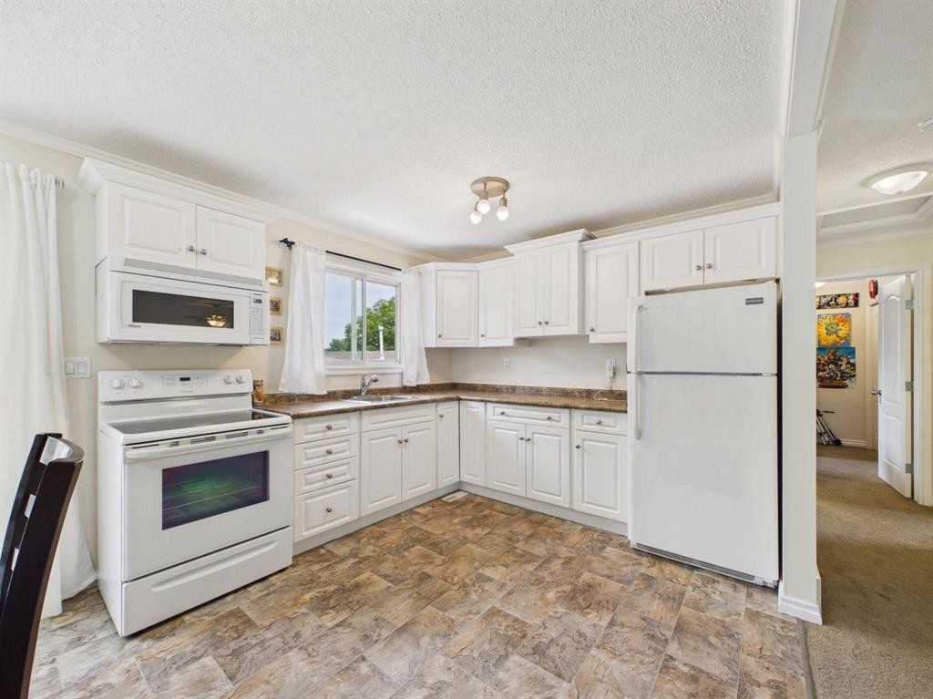 42 Greenham Drive, Red Deer, AB - Indoor Photo Showing Kitchen With Double Sink