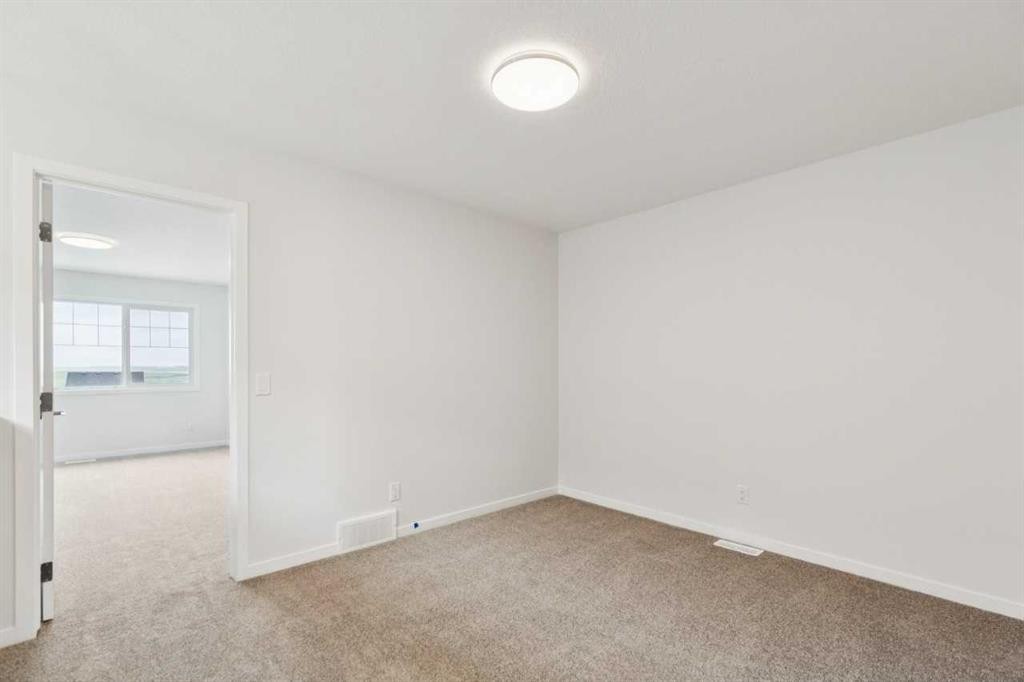 65 Aquila Terrace Nw, Calgary, AB - Indoor Photo Showing Other Room