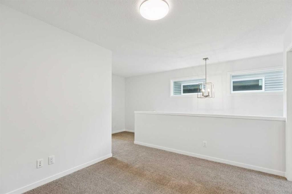 65 Aquila Terrace Nw, Calgary, AB - Indoor Photo Showing Other Room
