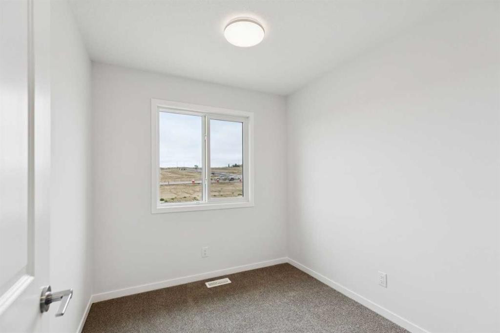 65 Aquila Terrace Nw, Calgary, AB - Indoor Photo Showing Other Room