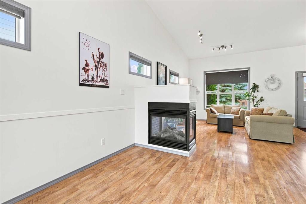 132 Downing Close, Red Deer, AB - Indoor Photo Showing Living Room With Fireplace