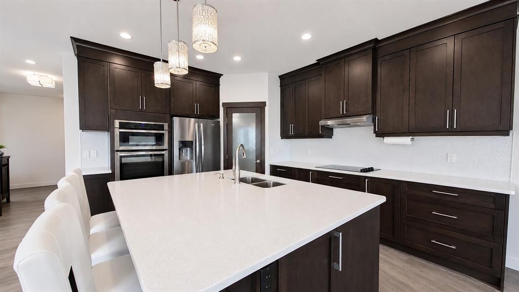 78 Cranarch View Se, Calgary, AB - Indoor Photo Showing Kitchen With Double Sink With Upgraded Kitchen
