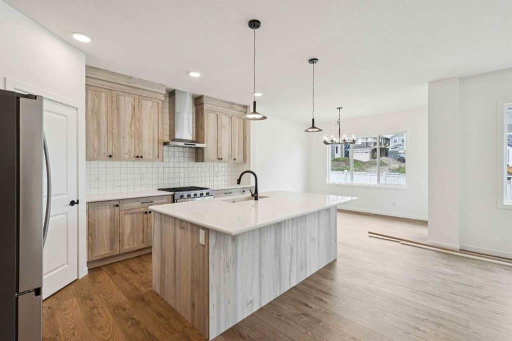 1030 Bayview Crescent Sw, Airdrie, AB - Indoor Photo Showing Kitchen With Upgraded Kitchen