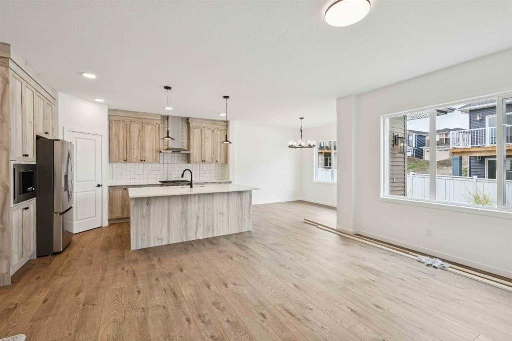 1030 Bayview Crescent Sw, Airdrie, AB - Indoor Photo Showing Kitchen With Stainless Steel Kitchen With Upgraded Kitchen