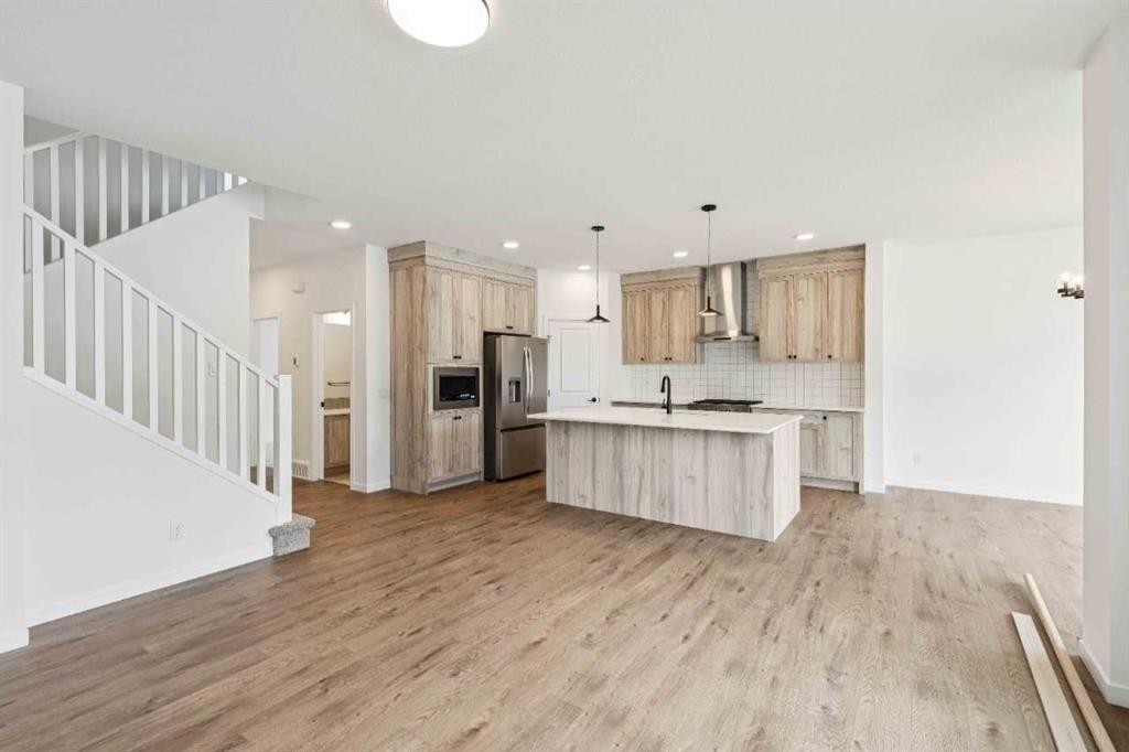1030 Bayview Crescent Sw, Airdrie, AB - Indoor Photo Showing Kitchen With Stainless Steel Kitchen With Upgraded Kitchen