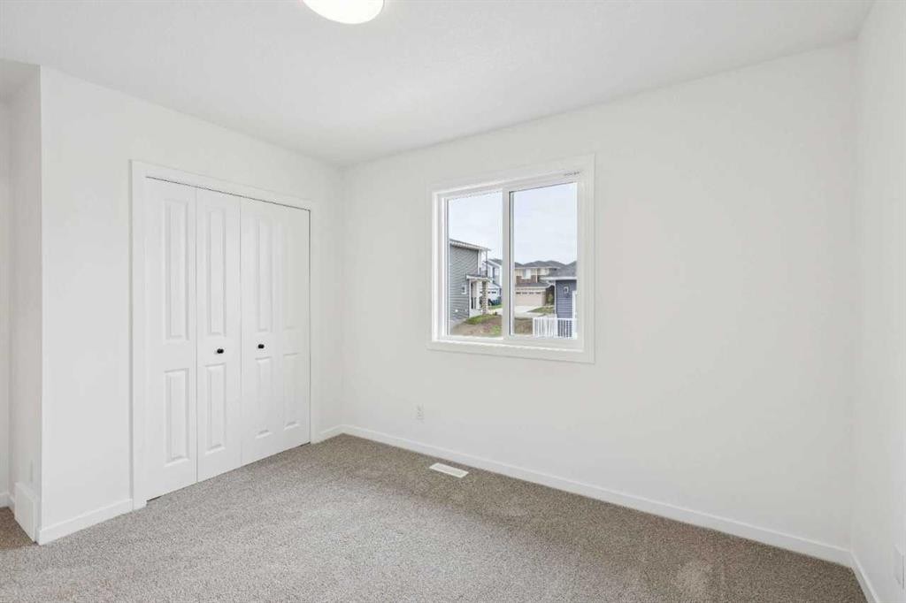 1030 Bayview Crescent Sw, Airdrie, AB - Indoor Photo Showing Other Room