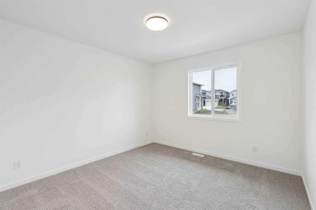 1030 Bayview Crescent Sw, Airdrie, AB - Indoor Photo Showing Other Room