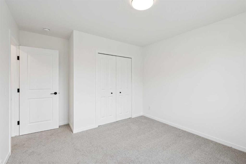 1030 Bayview Crescent Sw, Airdrie, AB - Indoor Photo Showing Other Room