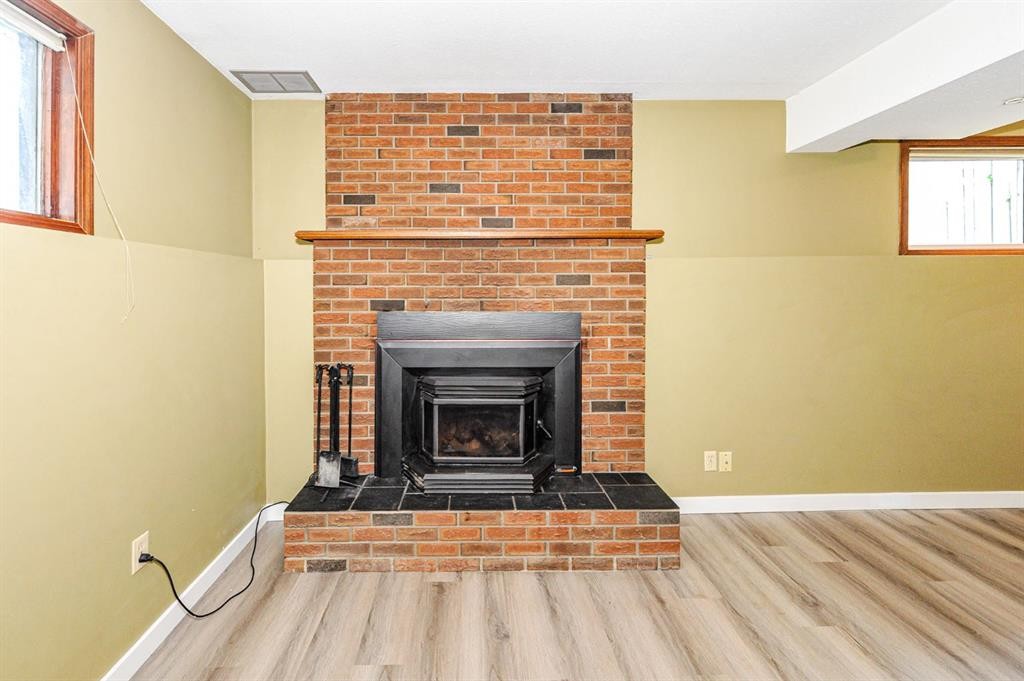68 Elliott Drive, Camrose, AB - Indoor Photo Showing Living Room With Fireplace