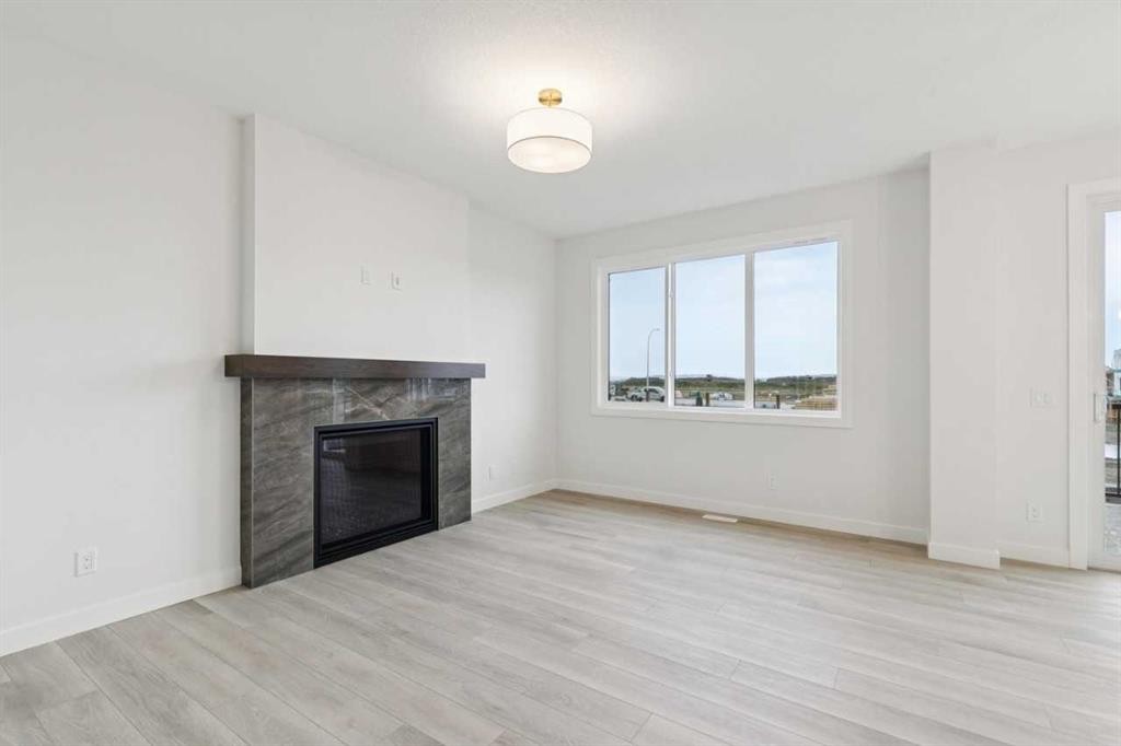 139 Fireside Close, Cochrane, AB - Indoor Photo Showing Living Room With Fireplace