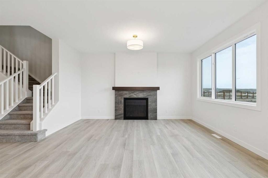 139 Fireside Close, Cochrane, AB - Indoor Photo Showing Living Room With Fireplace