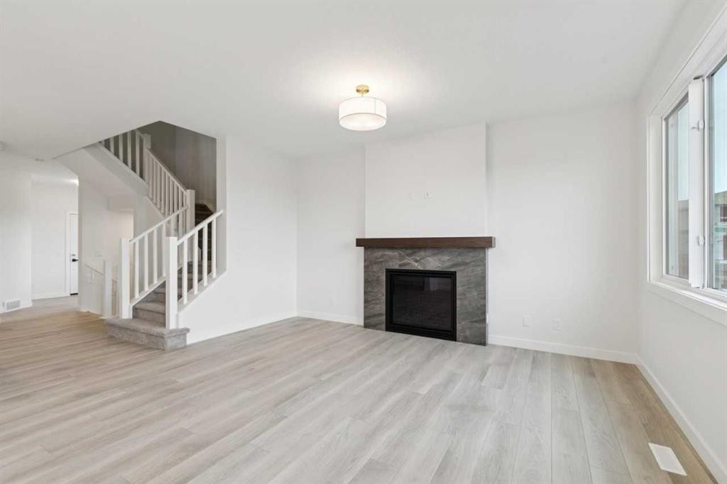 139 Fireside Close, Cochrane, AB - Indoor Photo Showing Living Room With Fireplace