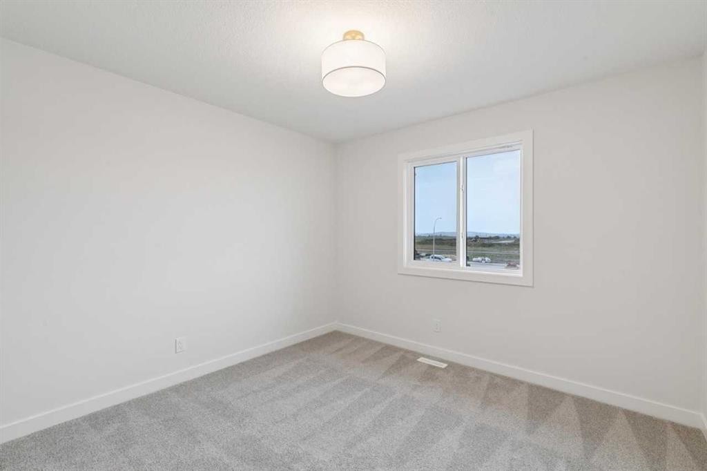 139 Fireside Close, Cochrane, AB - Indoor Photo Showing Other Room
