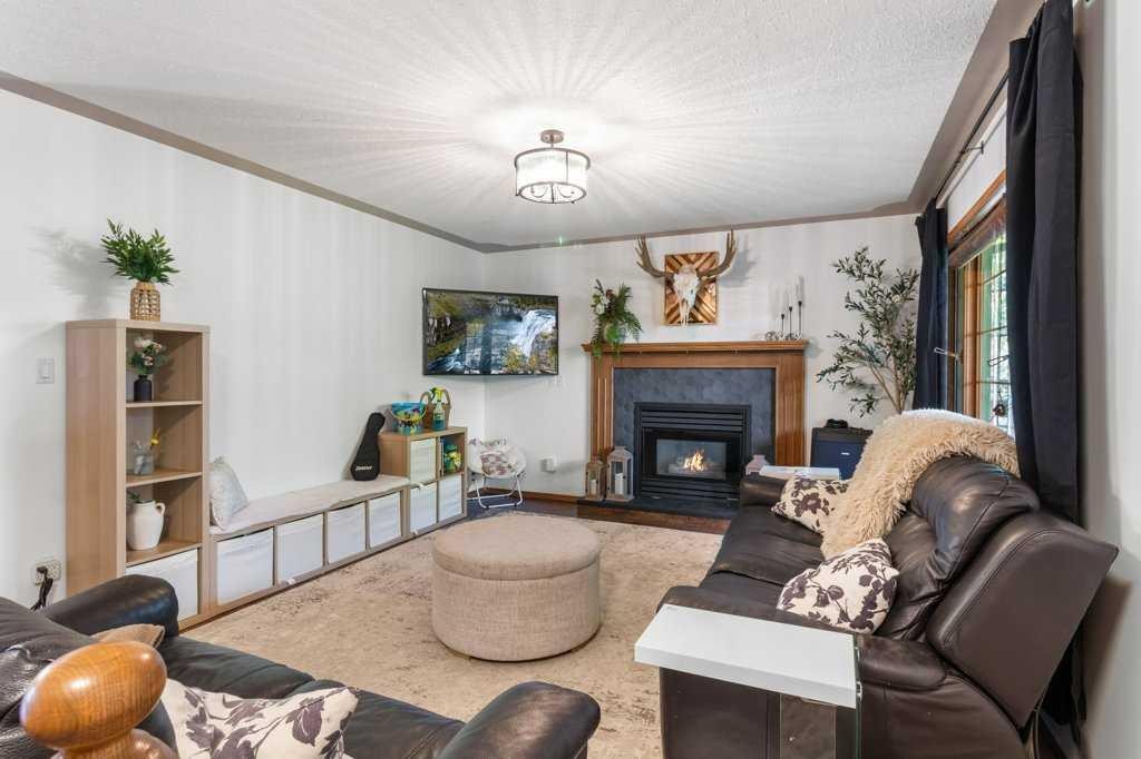 2206 25 Avenue, Delburne, AB - Indoor Photo Showing Living Room With Fireplace