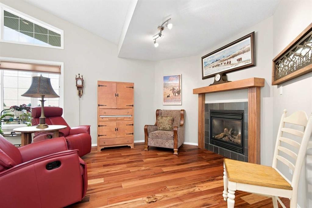 2 Pheasantback Close, Stettler, AB - Indoor Photo Showing Living Room With Fireplace